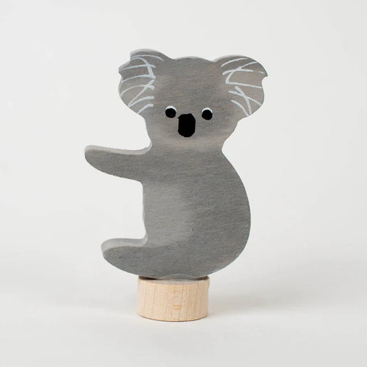 Wooden koala decoration on a white background