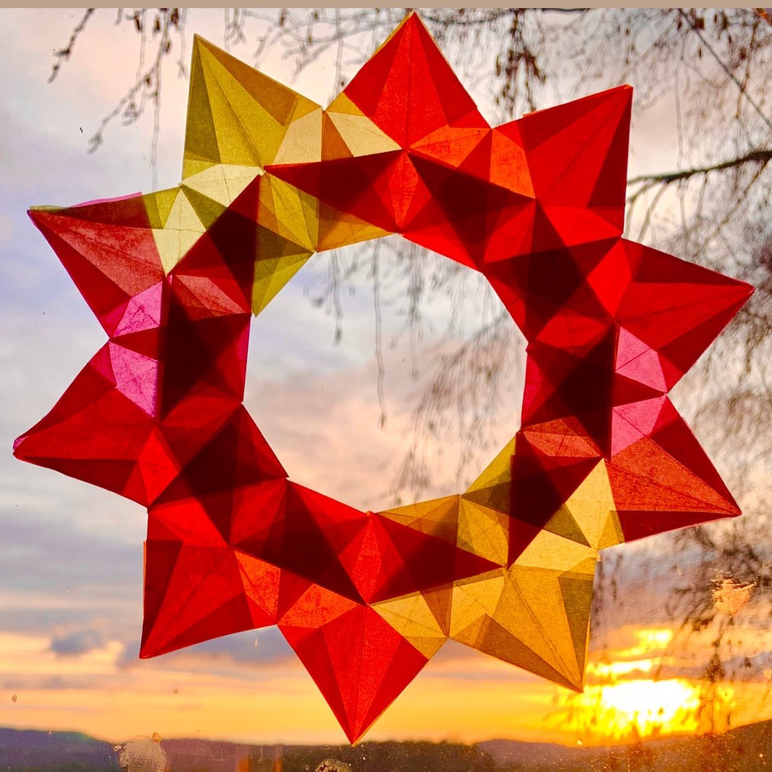 complex kite paper star wreath takes 2 hours of precise measuring, cutting, folding, and glueing 